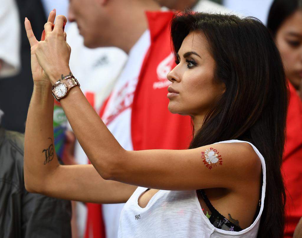 A Poland fan takes a photograph during the Euro 2016 group C football match between Germany and Poland at the Stade de France stadium in Saint-Denis near Paris on June 16, 2016. / AFP PHOTO / FRANCK FIFE